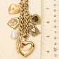 Keep Them Guessing Assorted Charms Statement Necklace, Gold