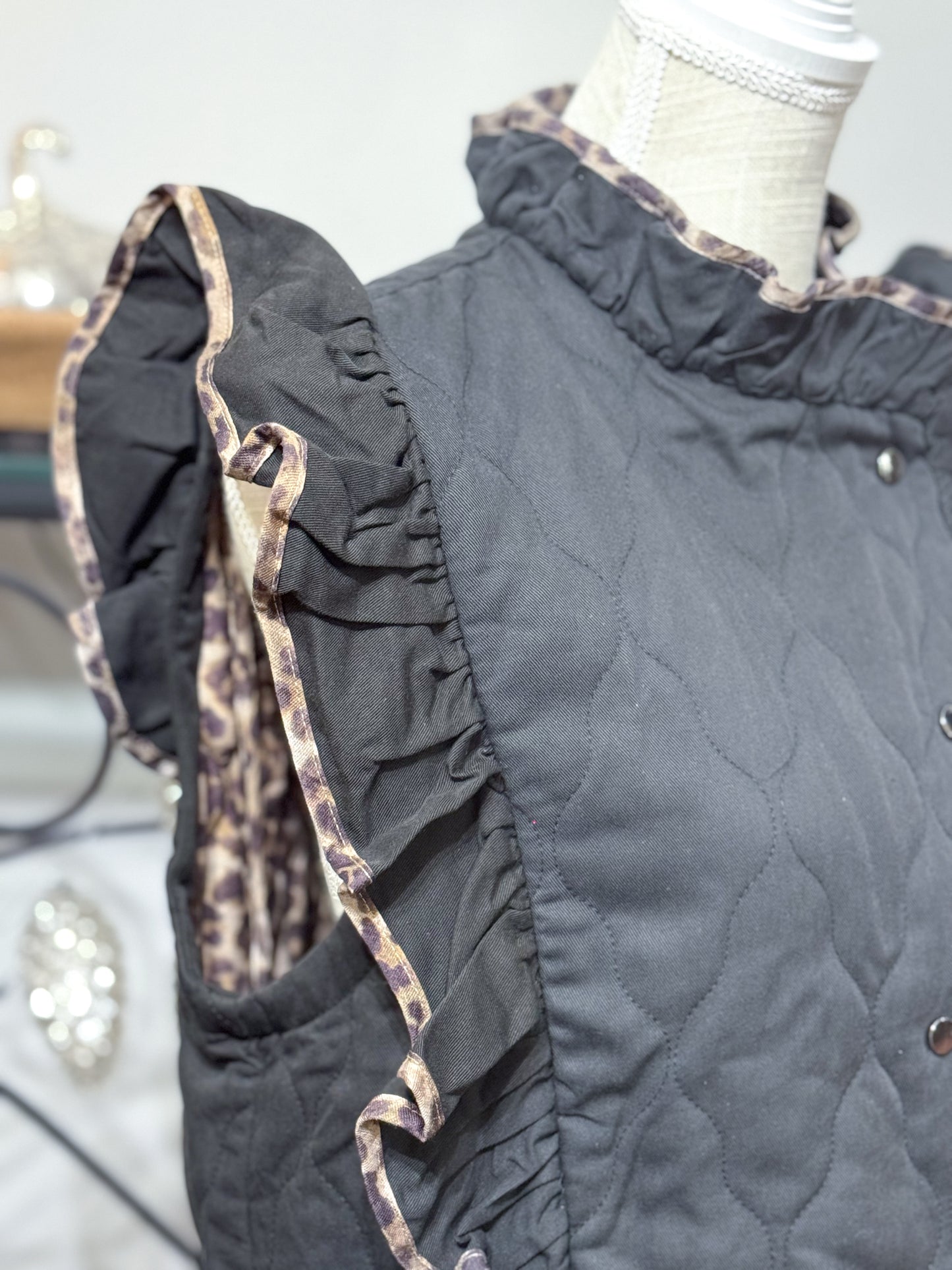 She Reigns Leopard Trim Quilted Ruffle Vest, Black