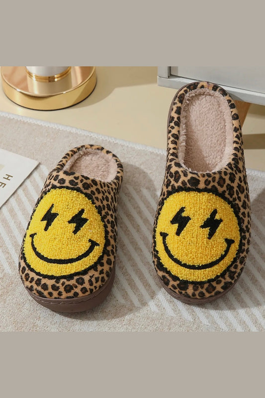 Pair of leopard print slippers with smiley face design